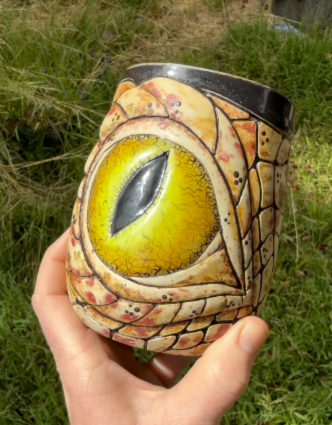 Pink and purple handmade ceramic mug with soft vertical carved pattern and drippy multicolor glaze, carved with DiamondCore tools.