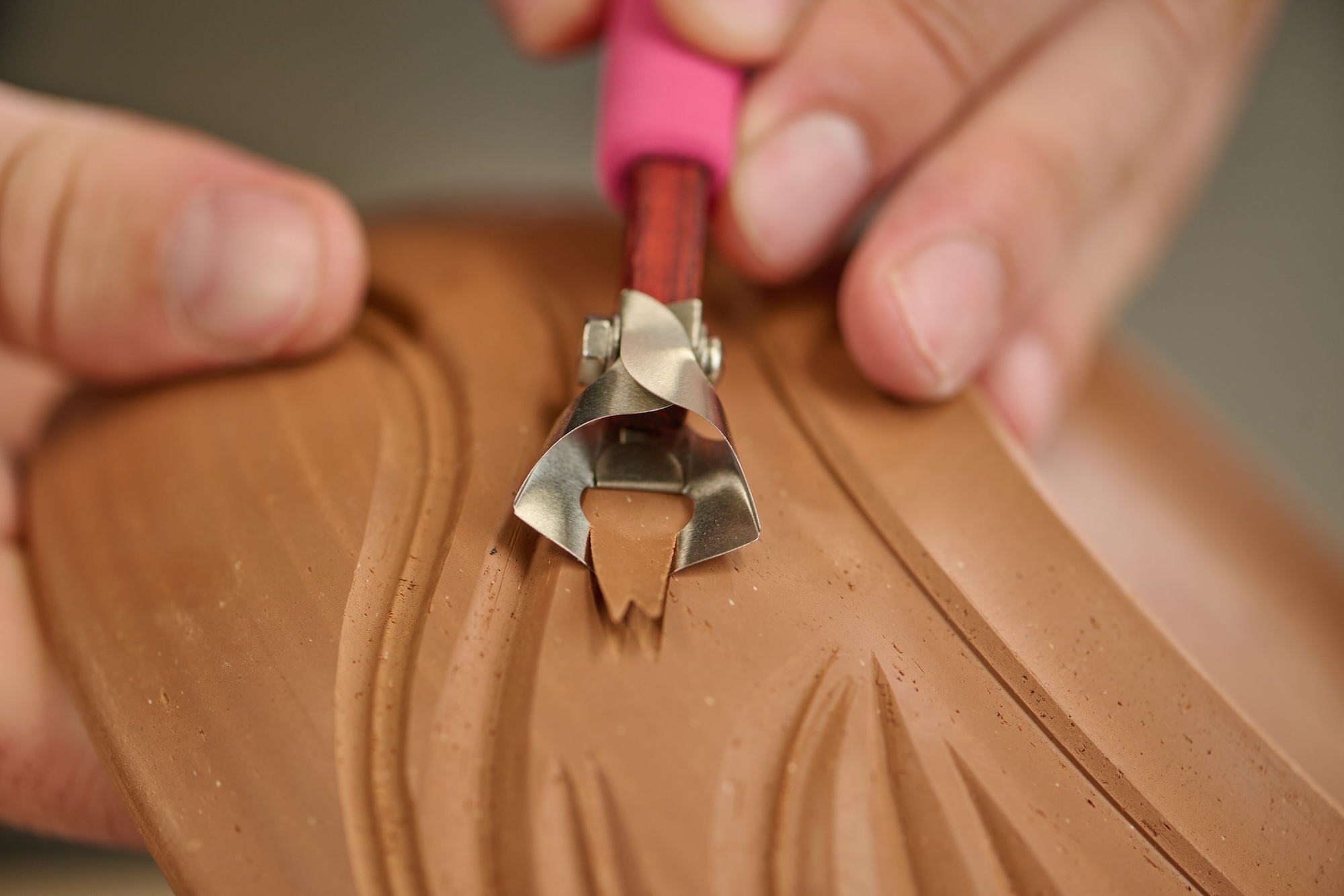 X8 double U fluting tools carving into clay