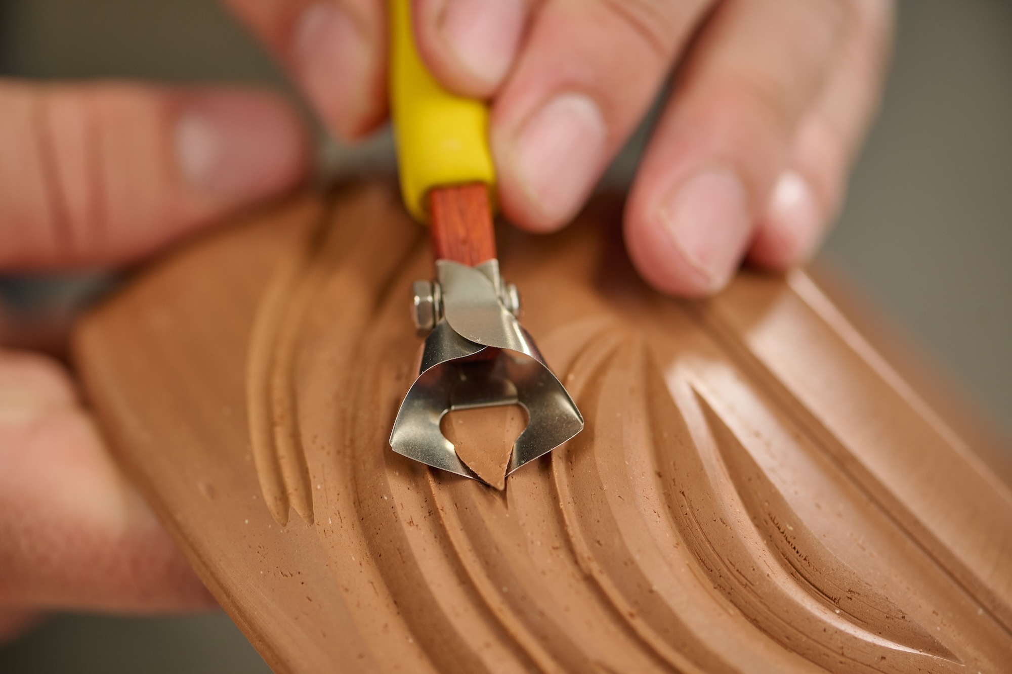 X1 12 mm V Fluting Tool carving into clay