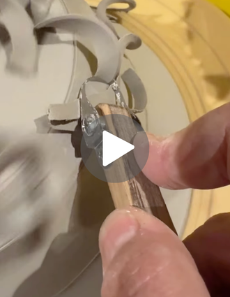 DiamondCore® trimming tool in action, shaving smooth ribbons of clay from the base of a wheel-thrown pot.